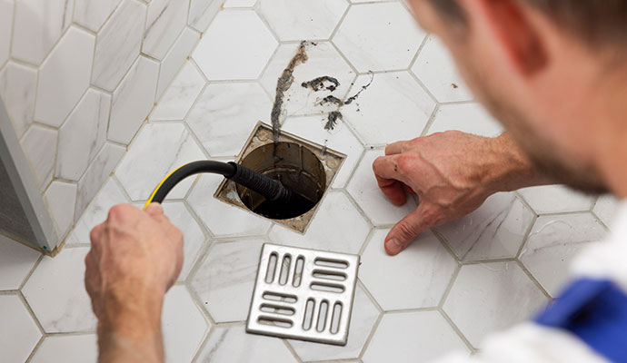 Cleaning a Clogged Drain Pipe