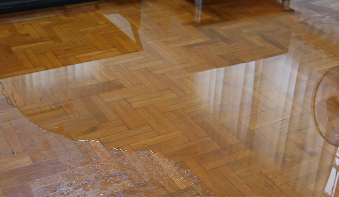 Water damaged herringbone wood floor
