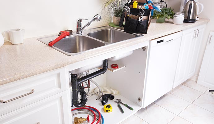 Newly installed plumbing beneath the sink