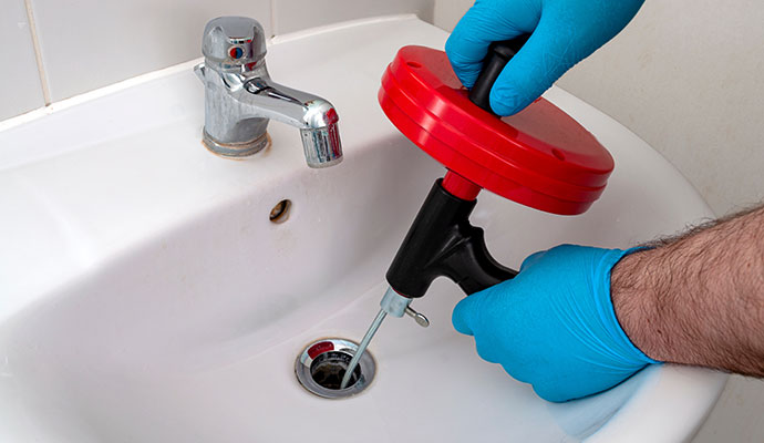 A professional cleaning drain sink