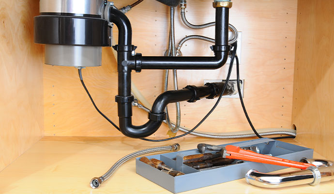 Garbage disposal repairing service in progress