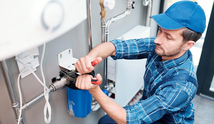 Plumber is repairing filtration system
