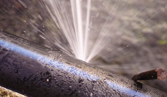 Water spraying out from a broken pipe